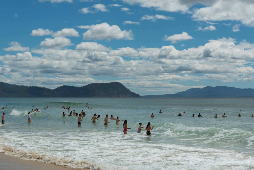 Festival goers hit Marion Ba beach during Falls Festival 2017