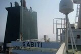 The name Sabiti is written onto the deck of a ship.