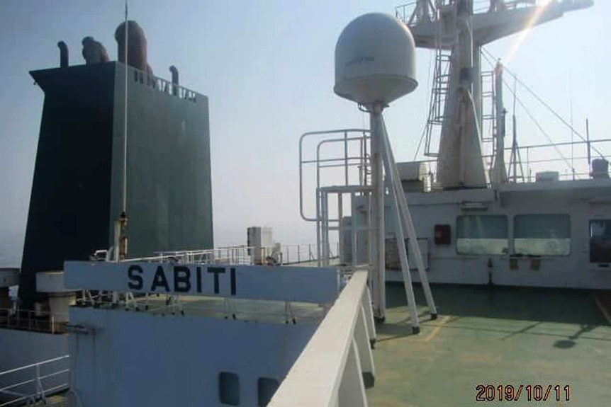 The name Sabiti is written onto the deck of a ship.