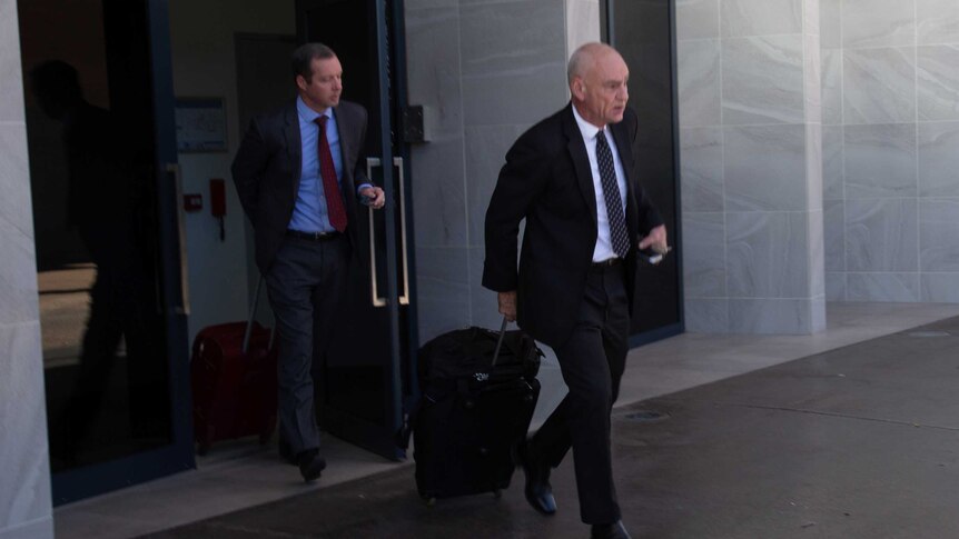Oliver Deighton's defence attorney Scott Corish leaving the Alice Springs courtroom.