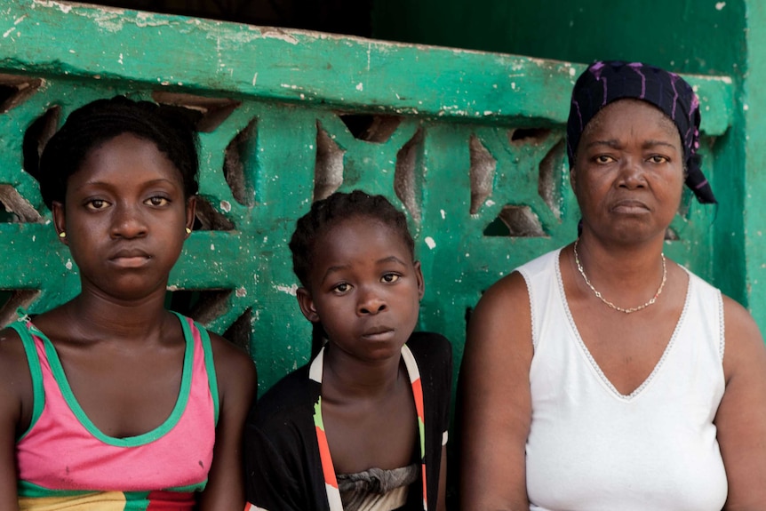 Bindu Sarmavula (right) with her granddaughters Asiatu and Monica.