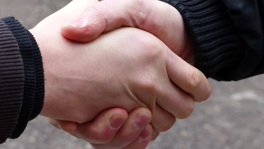 Close up of a handshake