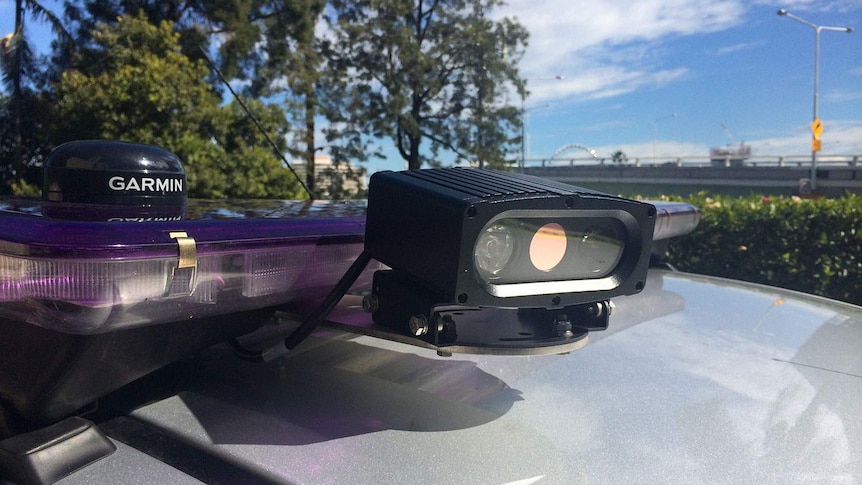Mobile camera on Queensland police car that will scan thousands of registration plates every week to catch unregistered cars.