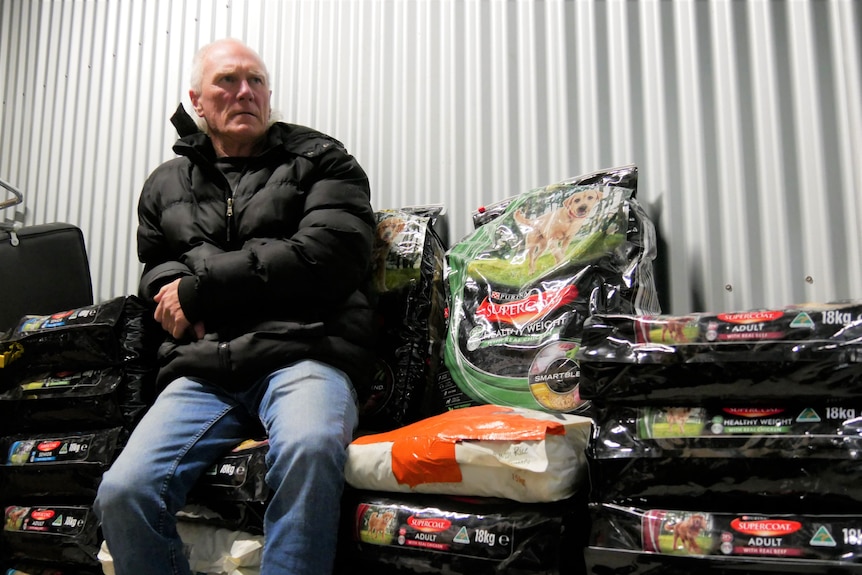 Man sits on dog food