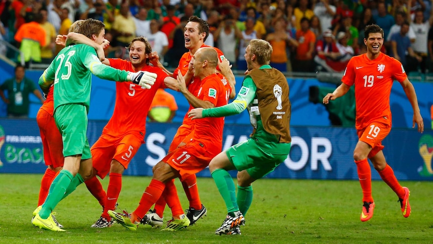 Tim Krul celebrates with Dutch team-mates after the penalty shootout against Costa Rica.