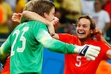 Tim Krul celebrates with Dutch team-mates after the penalty shootout against Costa Rica.