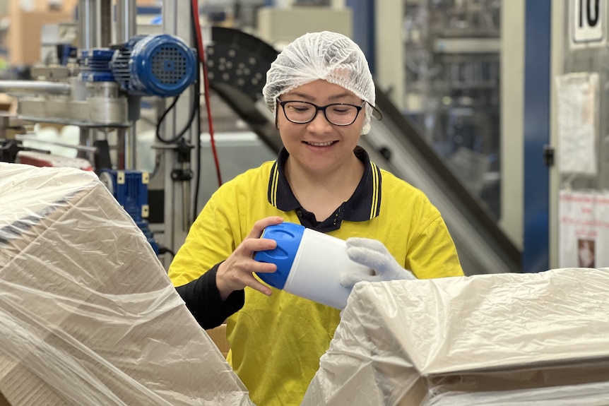 Female migrant worker pictured at plastic manufacturing factory