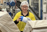 Female migrant worker pictured at plastic manufacturing factory