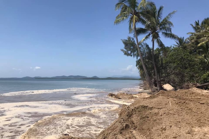 The king tide causes erosion along the beach at Midge Point north of Mackay.