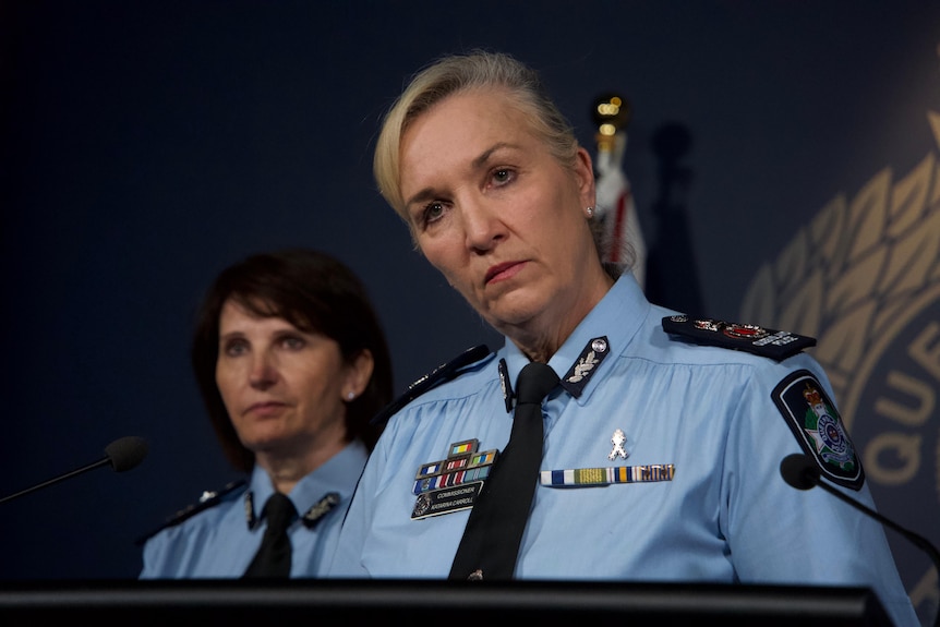 Katarina Carroll listening to a journalists question at a press conference. 