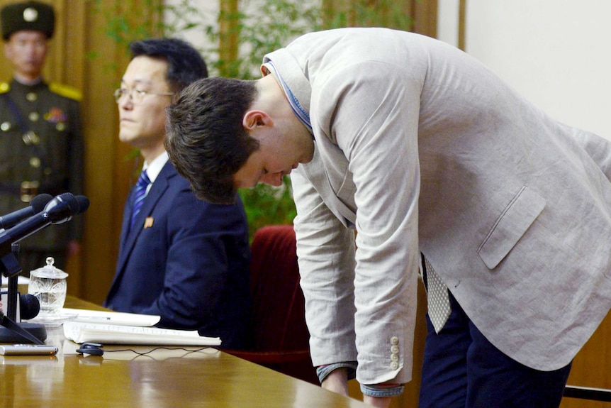 Otto Warmbier stands slouched in a North Korean court.