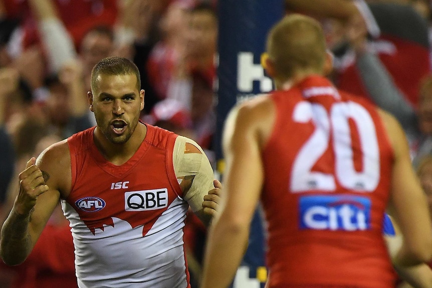 Lance Franklin and Sam Reid celebrate a goal for the Swans