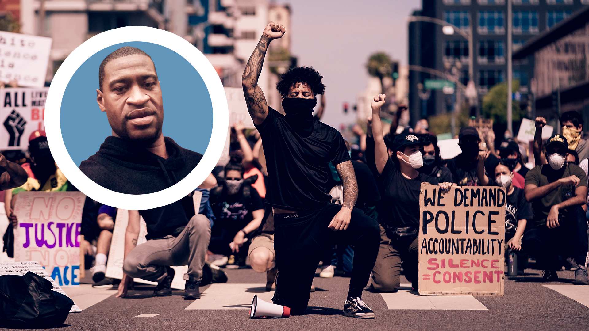 A man with many other protestors, hold up one first in solidarity with George Floyd (inset).