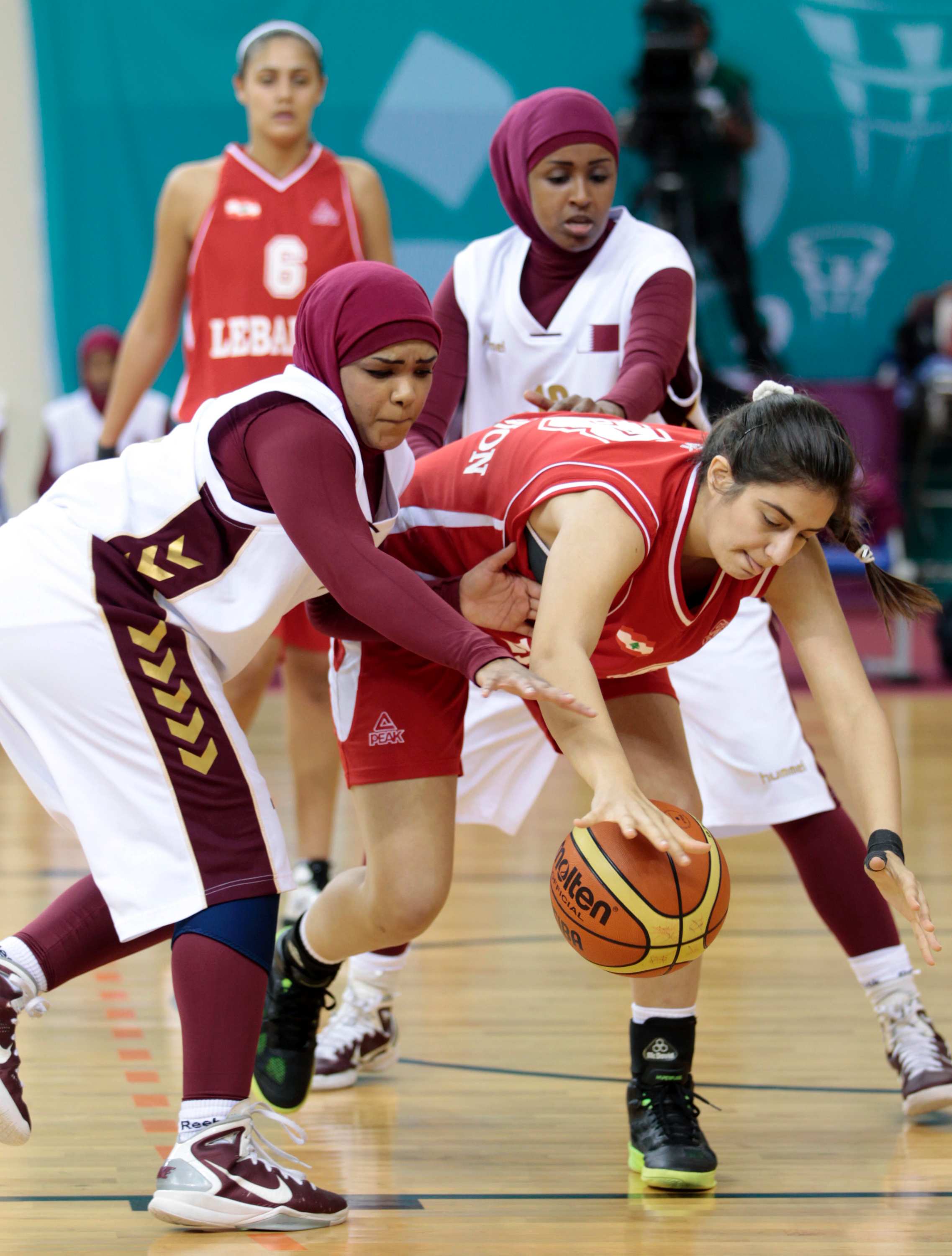 Qatar women's basketball team forfeits match saying hijab ban
