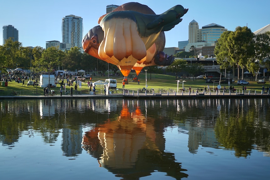 The famous Skywhale balloon accompanied by Skywhale Papa in Adelaide.