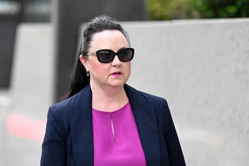 Senior forensic scientist Kylie Rika is seen leaving the Commission of Inquiry into Forensic DNA Testing in Queensland
