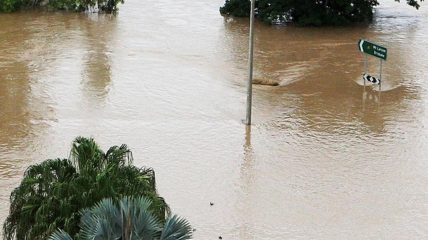 The welcome monument on the outskirts of Rockhampton is surrounded by floodwaters