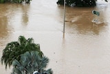 The welcome monument on the outskirts of Rockhampton is surrounded by floodwaters