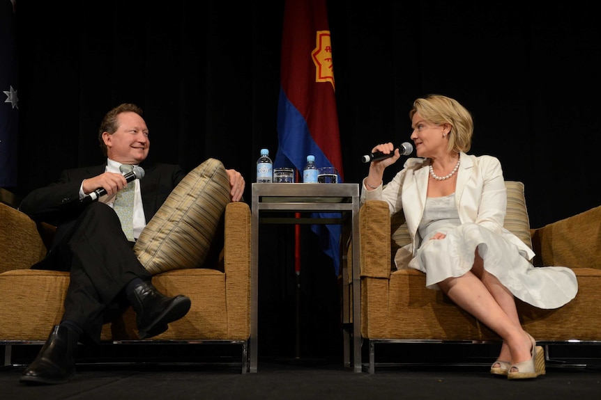 Andrew and Nicola Forrest sit on armchairs with microphones.