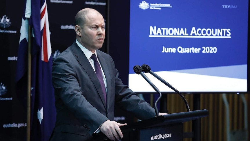 Josh Frydenberg at a podium.