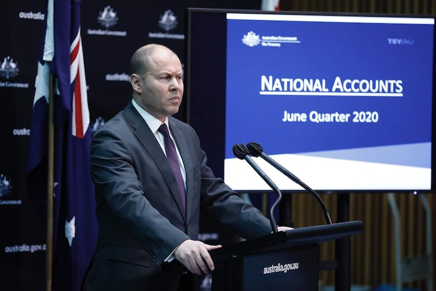 Josh Frydenberg at a podium.