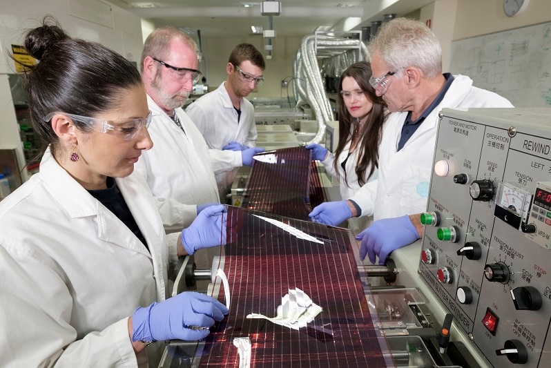 Researchers from CSIRO inspect printed solar