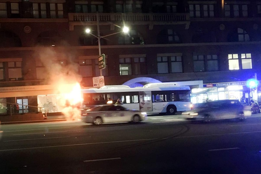 A bus on fire.