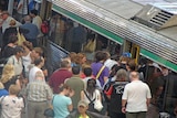 Train commuters at a Perth railway station