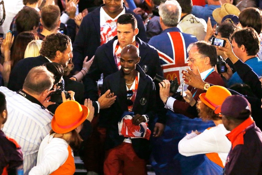 Britian's double gold medal winner Mohammed Farah arrives for the Closing Ceremony.