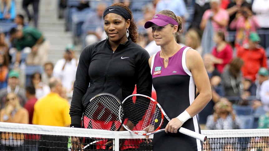 Serena Williams and Samantha Stosur pose at the net before their singles final at the 2011 US Open