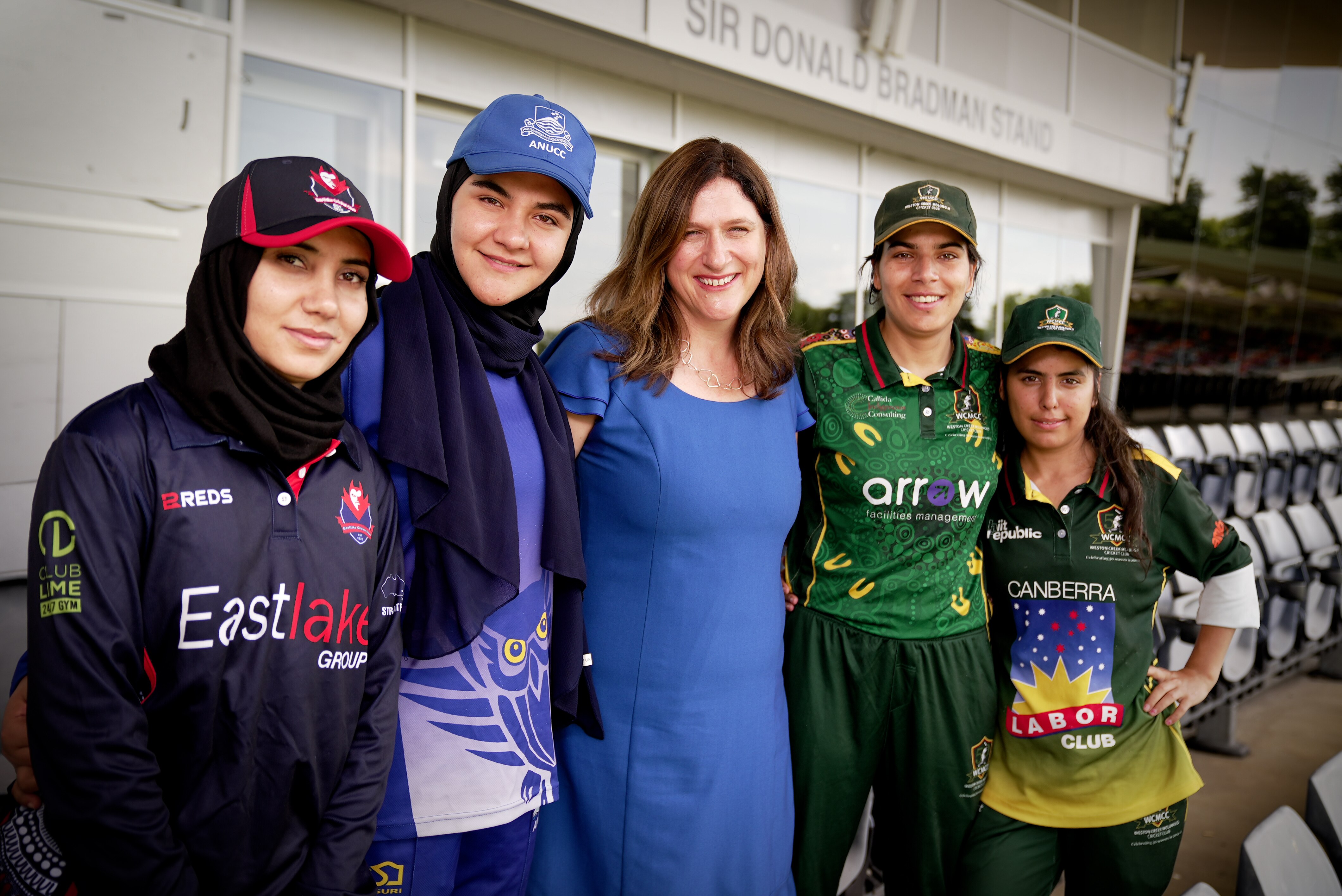 Women in cricket gear train at Manuka oval