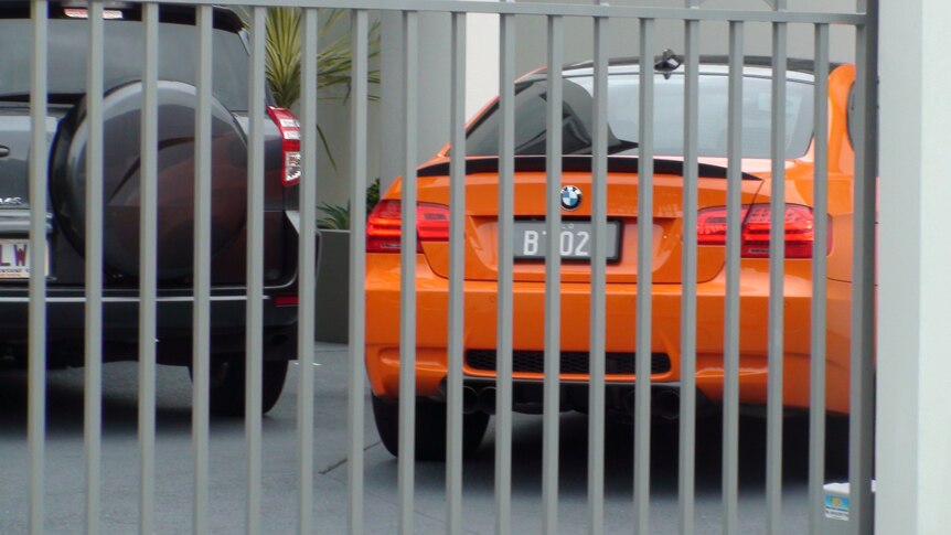 Bernard Tomic's car is locked behind a security gate at his Gold Coast home.