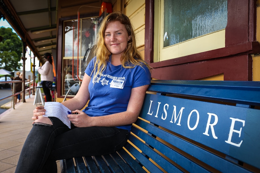 Maddy Braddon on bench seat at Lismore train station