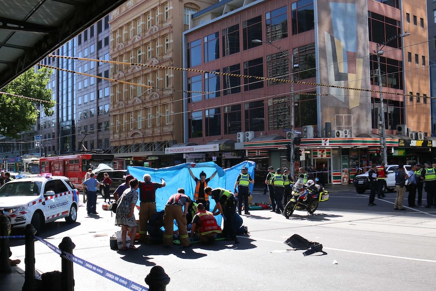 Paramedics on the scene in Flinders Street treating the injured.