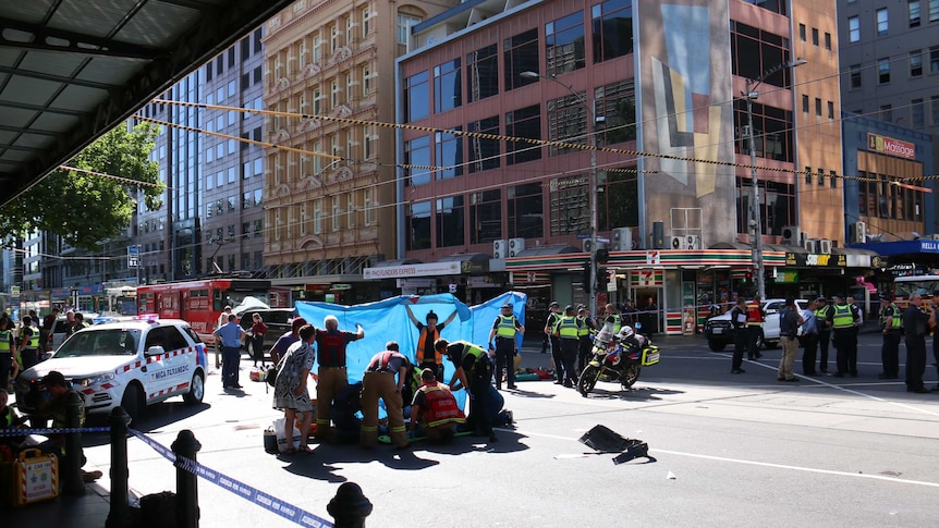 Paramedics on the scene in Flinders Street treating the injured.