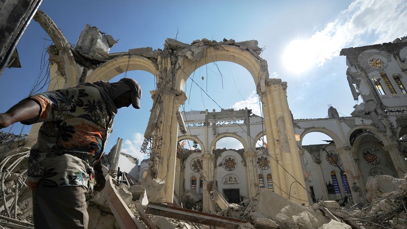 A man walks inside the destroyed Port-au-Prince cathedral