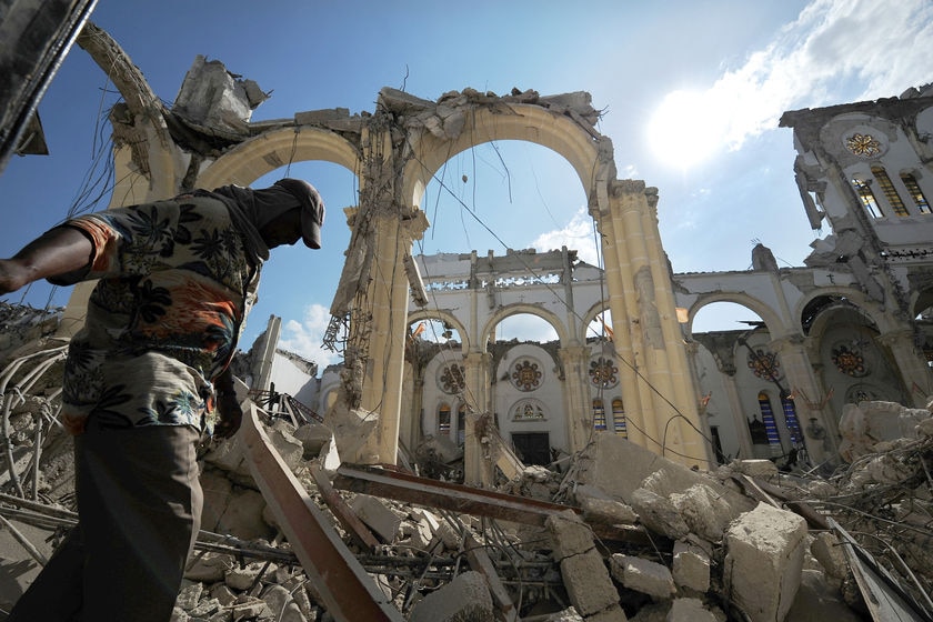 A man walks inside the destroyed Port-au-Prince cathedral