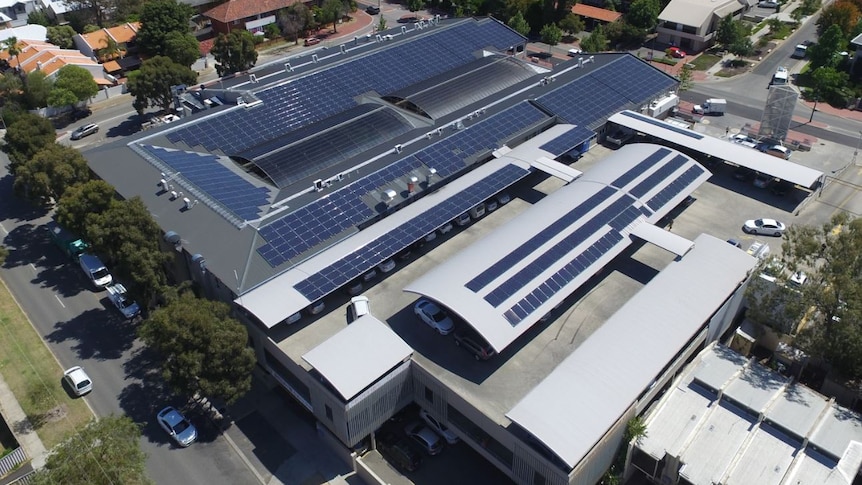 An aerial view of Broadway Shopping Centre which has had its roof covered in solar panels.