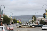 York Street in Albany with traffic and shops looking down to harbour.