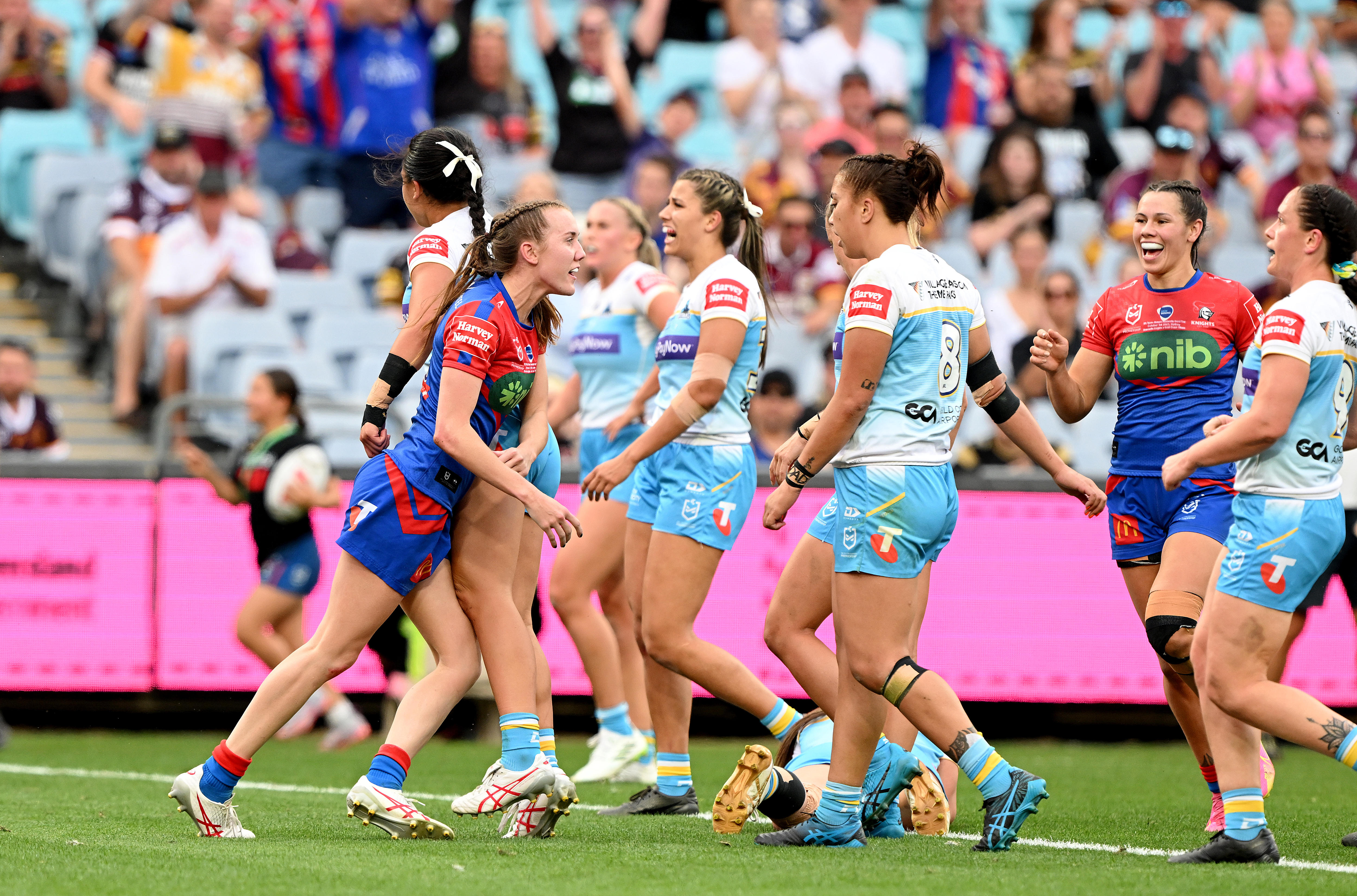 Tamika Upton of the Newcastle Knights gets up after scoring a try against the Gold Coast Titans in the NRL grand final.