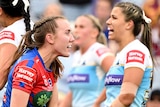 Tamika Upton of the Newcastle Knights gets up after scoring a try against the Gold Coast Titans in the NRL grand final.