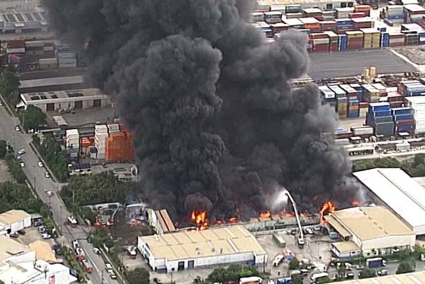 An aerial view of a large warehouse fire