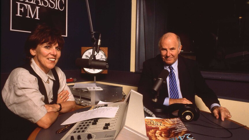 Margaret Throsby behind microphone interviewing Clive James in Classic FM studio.
