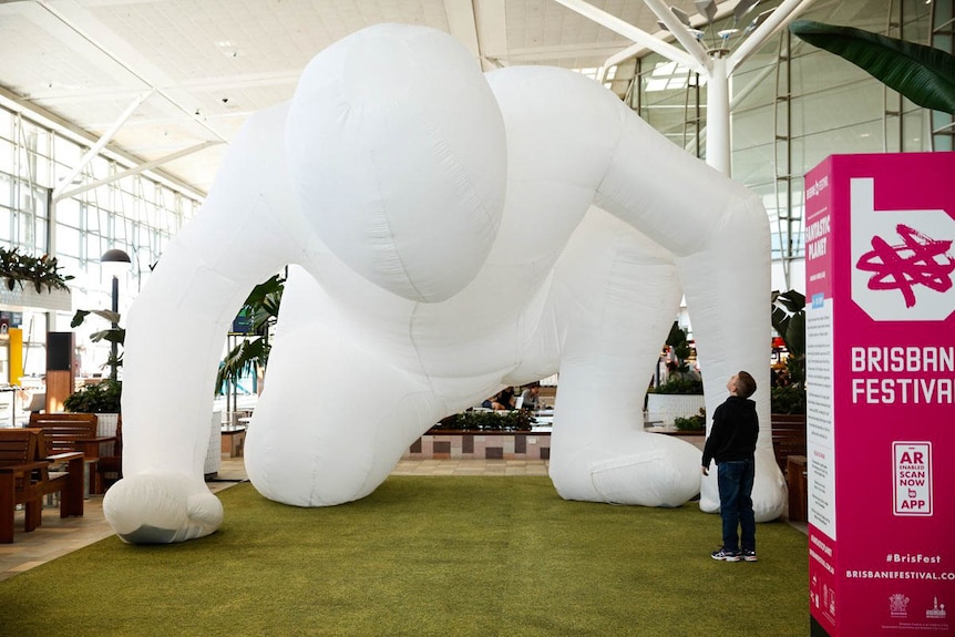 Giant inflatable humanoid in Brisbane International Airport.