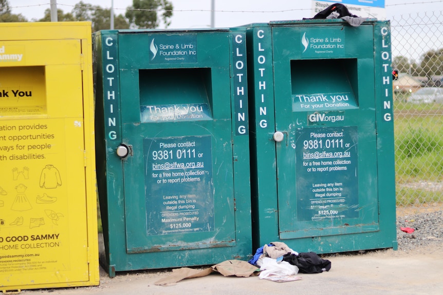 Three clothing donation bins. 