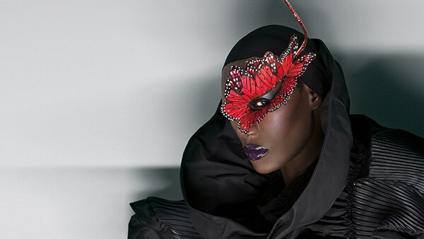 Jamaican singer Grace Jones wears a mask.