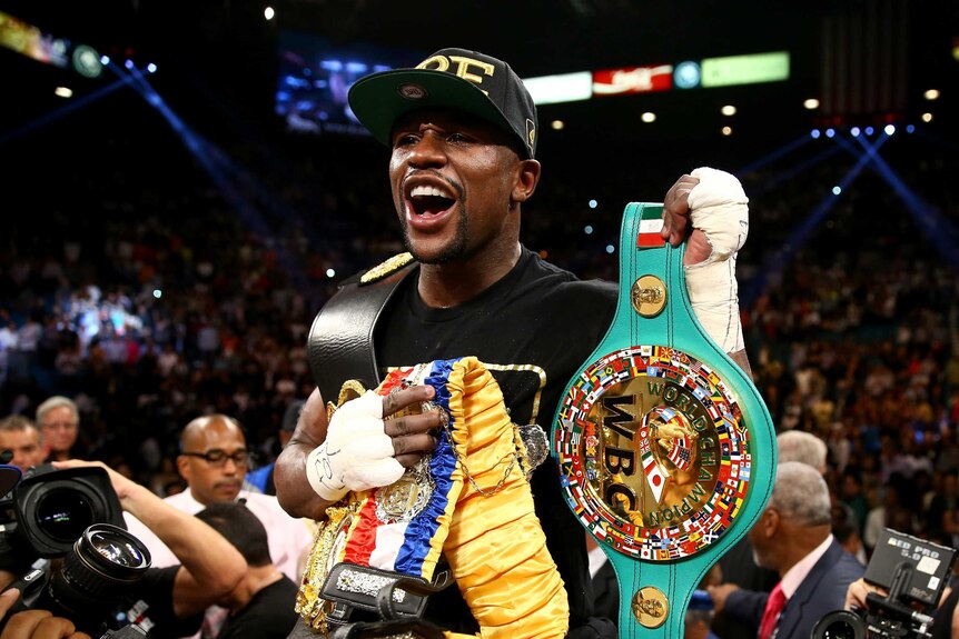 Mayweather Jr poses for the cameras