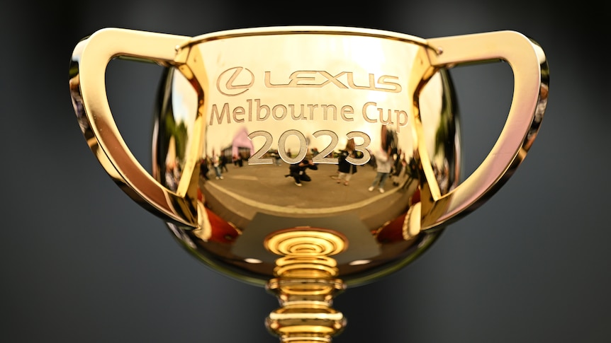 The top half of a gold trophy with Melbourne Cup 2023 engraved on it
