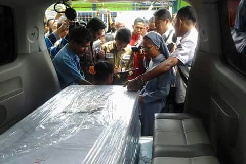 Adelina Sau's body being returned home.