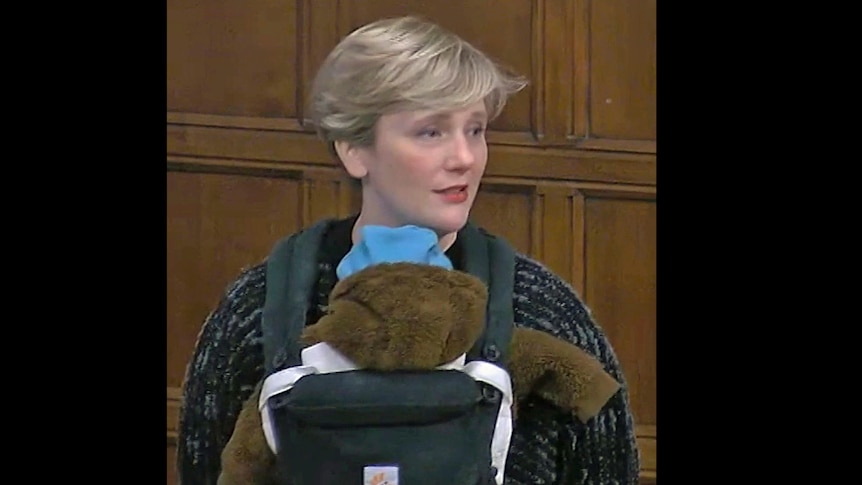 UK Labour MP Stella Creasy carries her son during a Westminster Hall debate in Parliment.